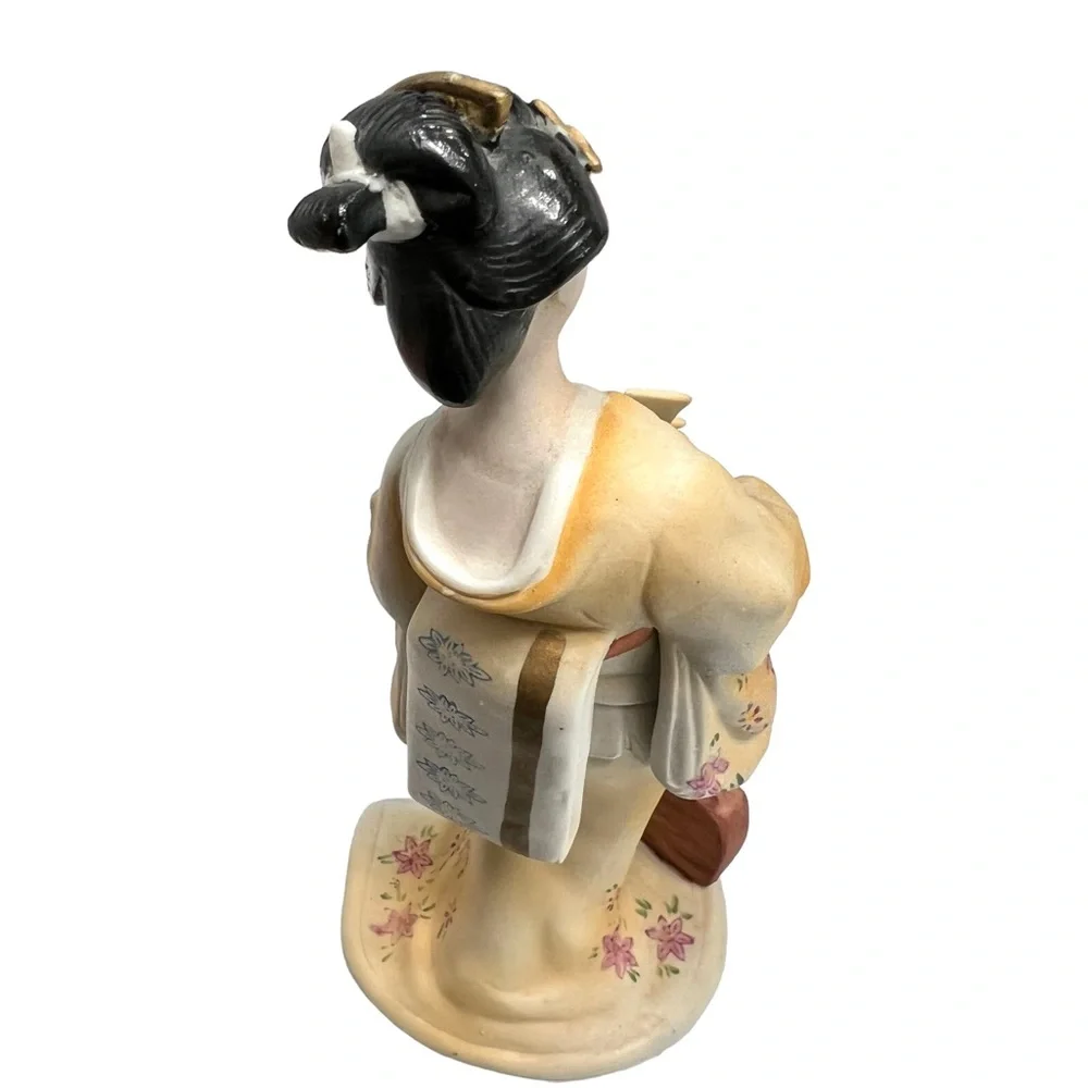 Vintage geisha holding